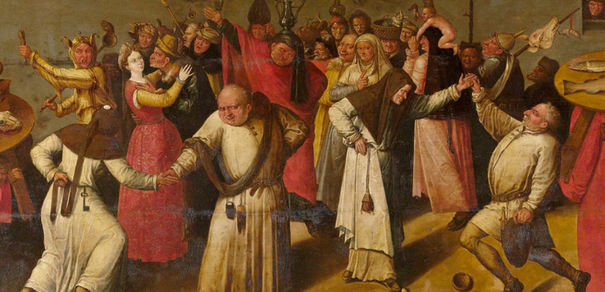 A group of people in medieval clothing fighting in the street